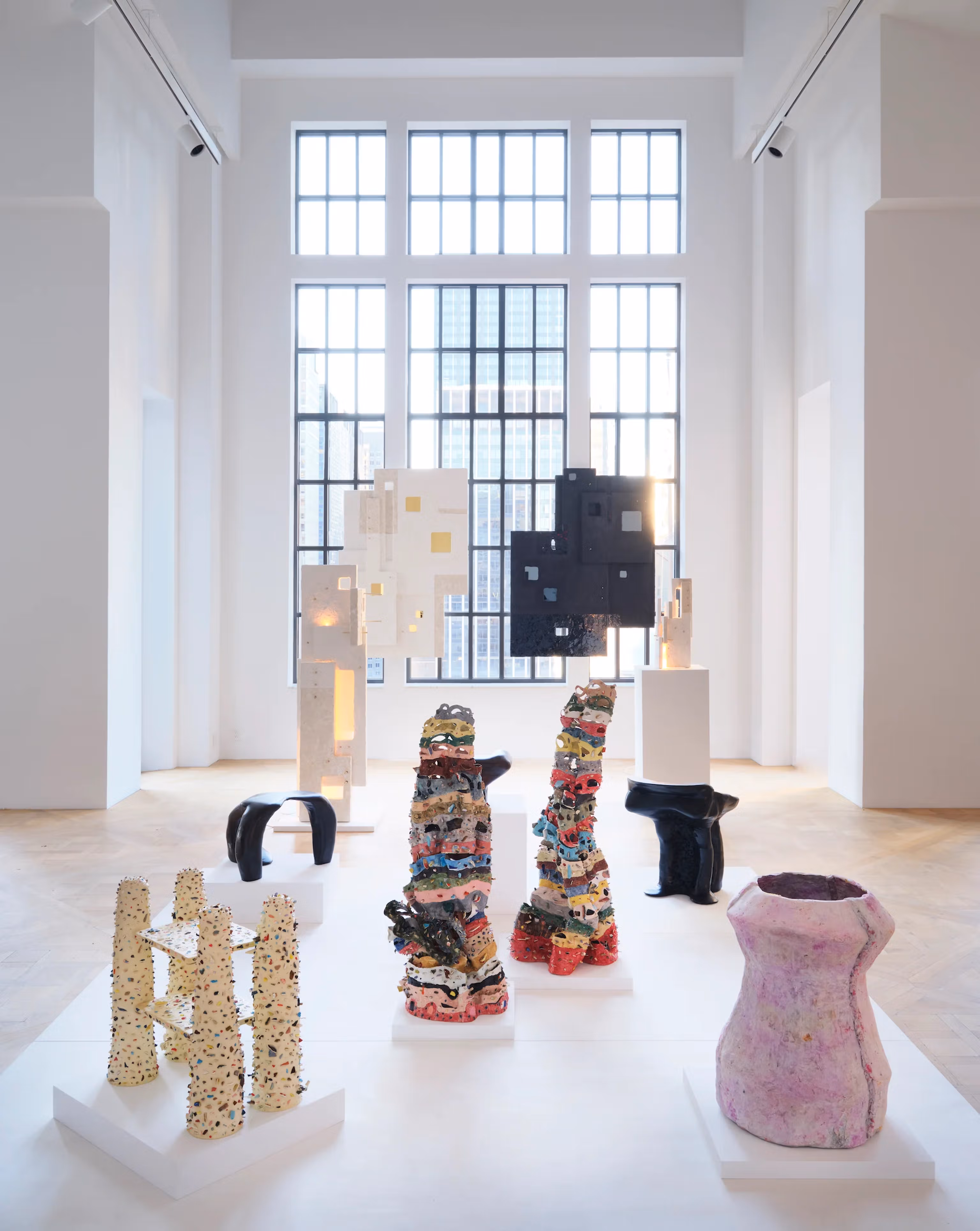 Sunlit gallery room with Isabella Maroon's sculptures
